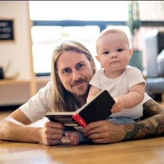 Dad Reading to Baby